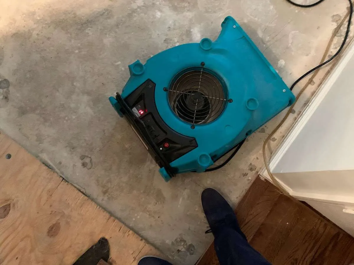 Air mover drying subfloor during Leak Detection & Repair in Beaver Falls
